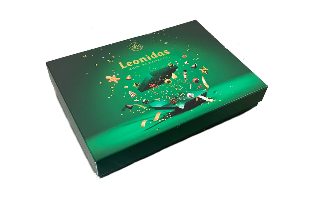 Green Leonidas chocolate box with decorative design on a white background